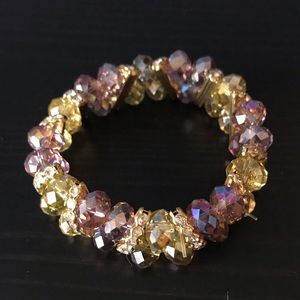 Beaded yellow, purple, and gold tone bracelet